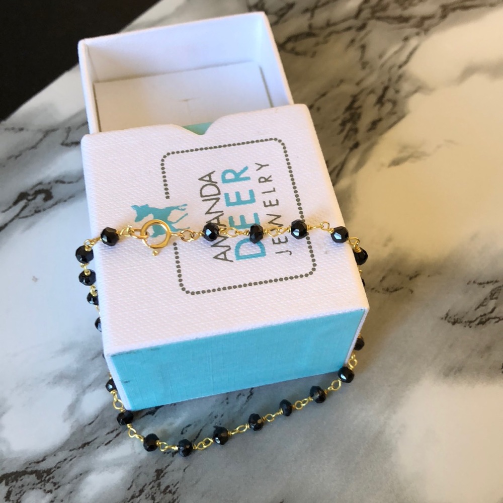 Black faux gemstone and gold fill bracelet.